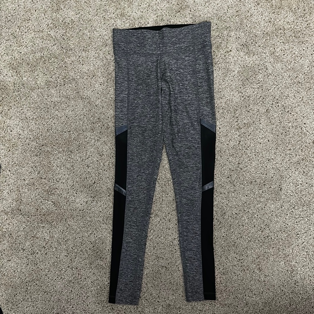 Pink “Ultimate” leggings with sheer detail on the side